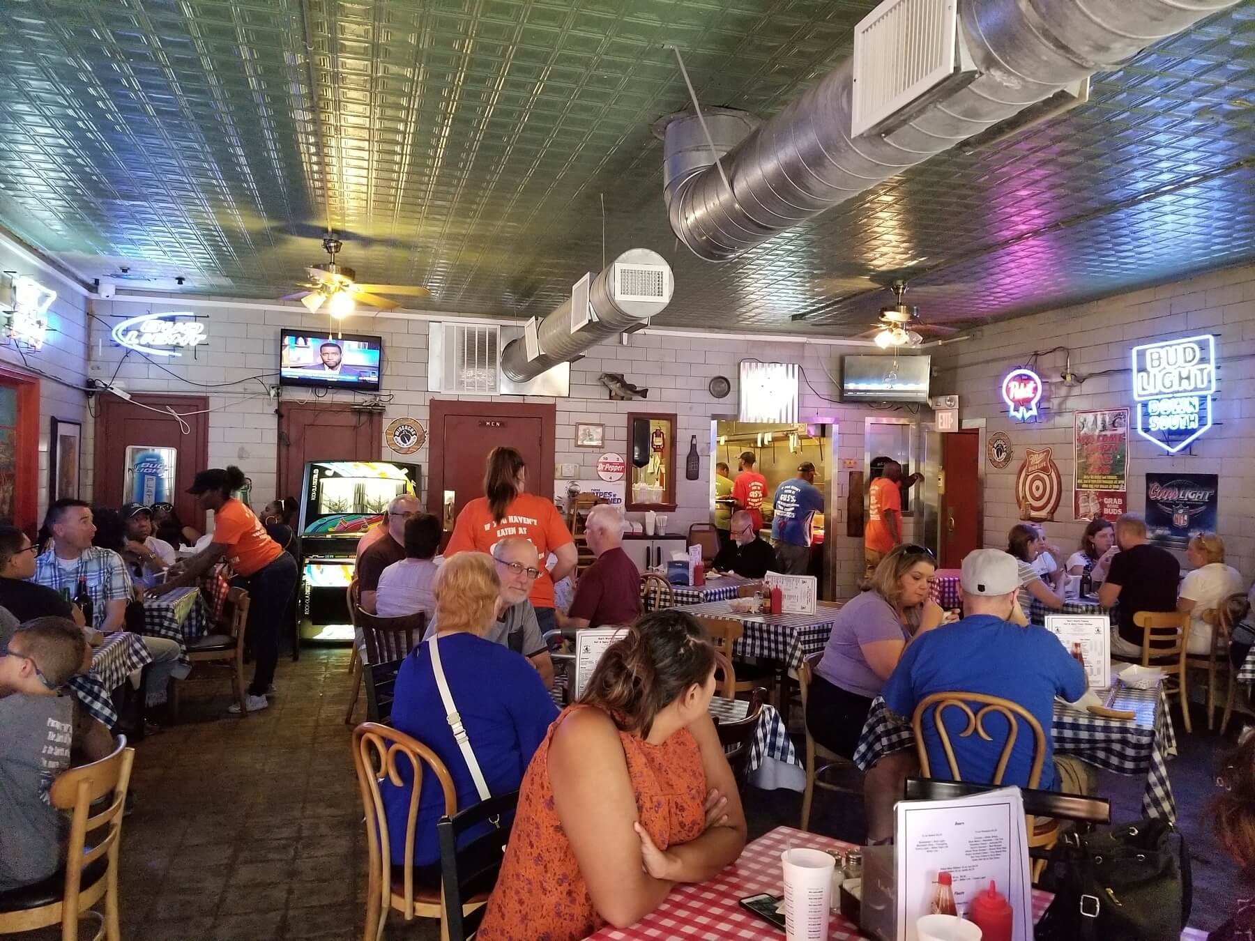People eating inside Gus's Fried Chicken on Front Street in Memphis, TN.