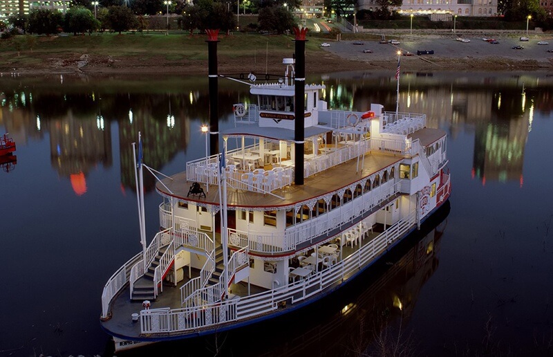 A riverboat on the river at dusk.