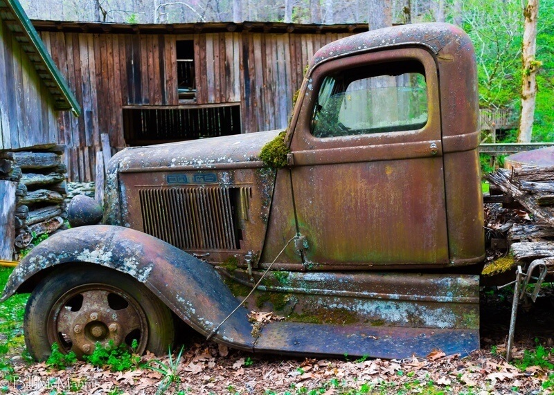 Rusted Dodge Ford pick-up truck outside Ely's Mill in Gatlinburg, TN