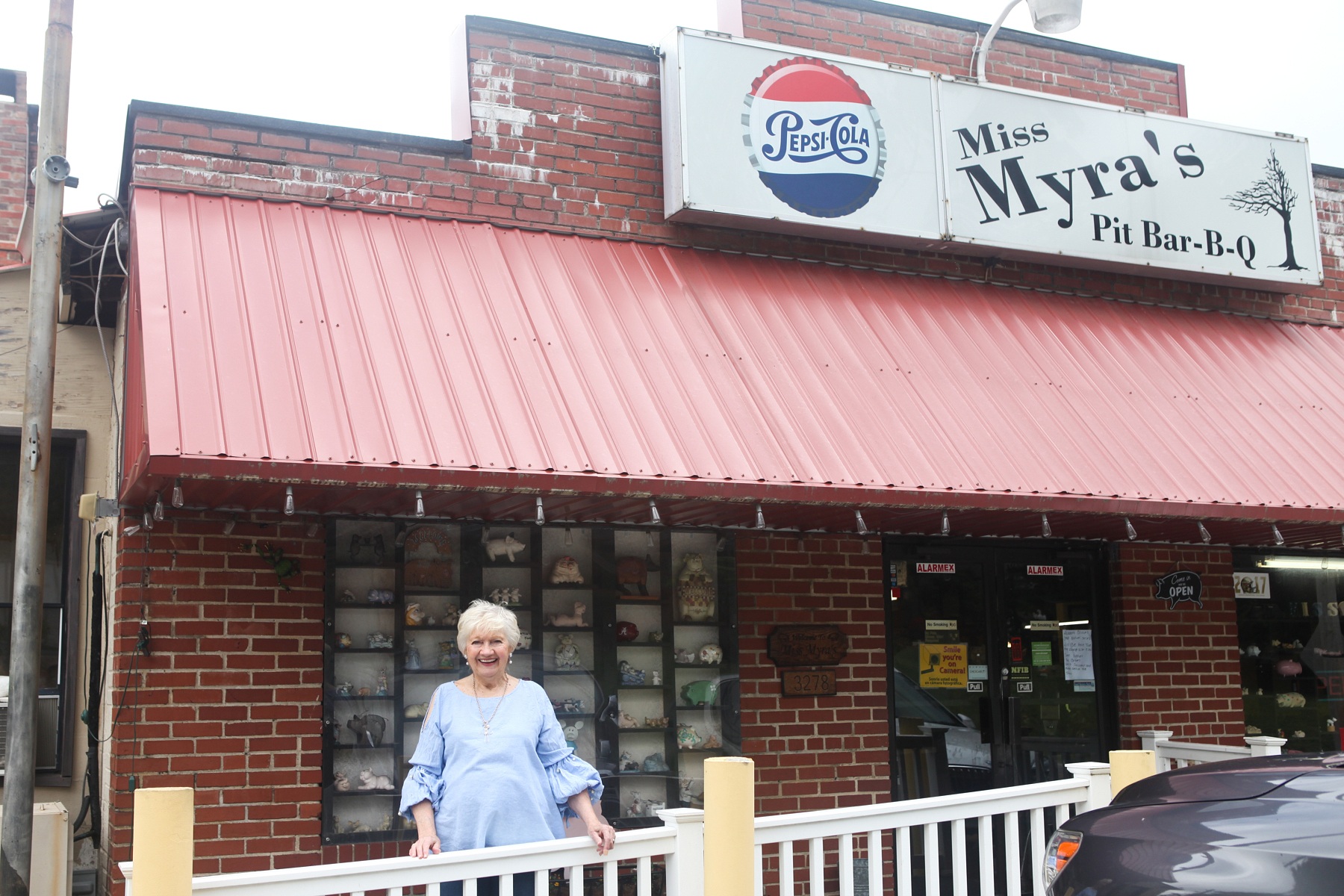 Myra Grissom Harper, a.k.a. "Miss Myra" of Miss Myra’s Pit Bar-B-Q stands proudly before her pit Bar-B-Q joint in Cahaba Heights.