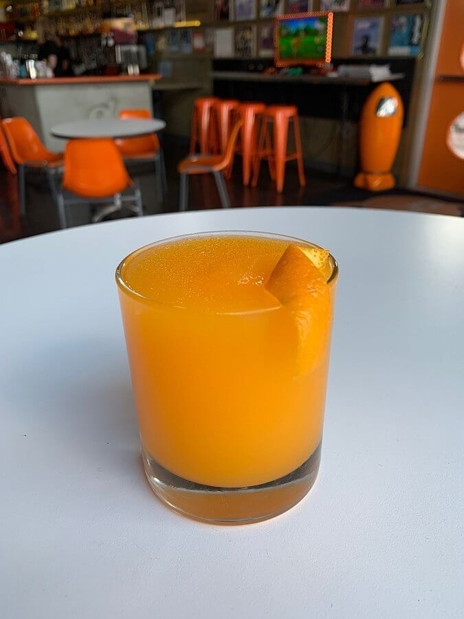 frozen orange drink with an orange slice