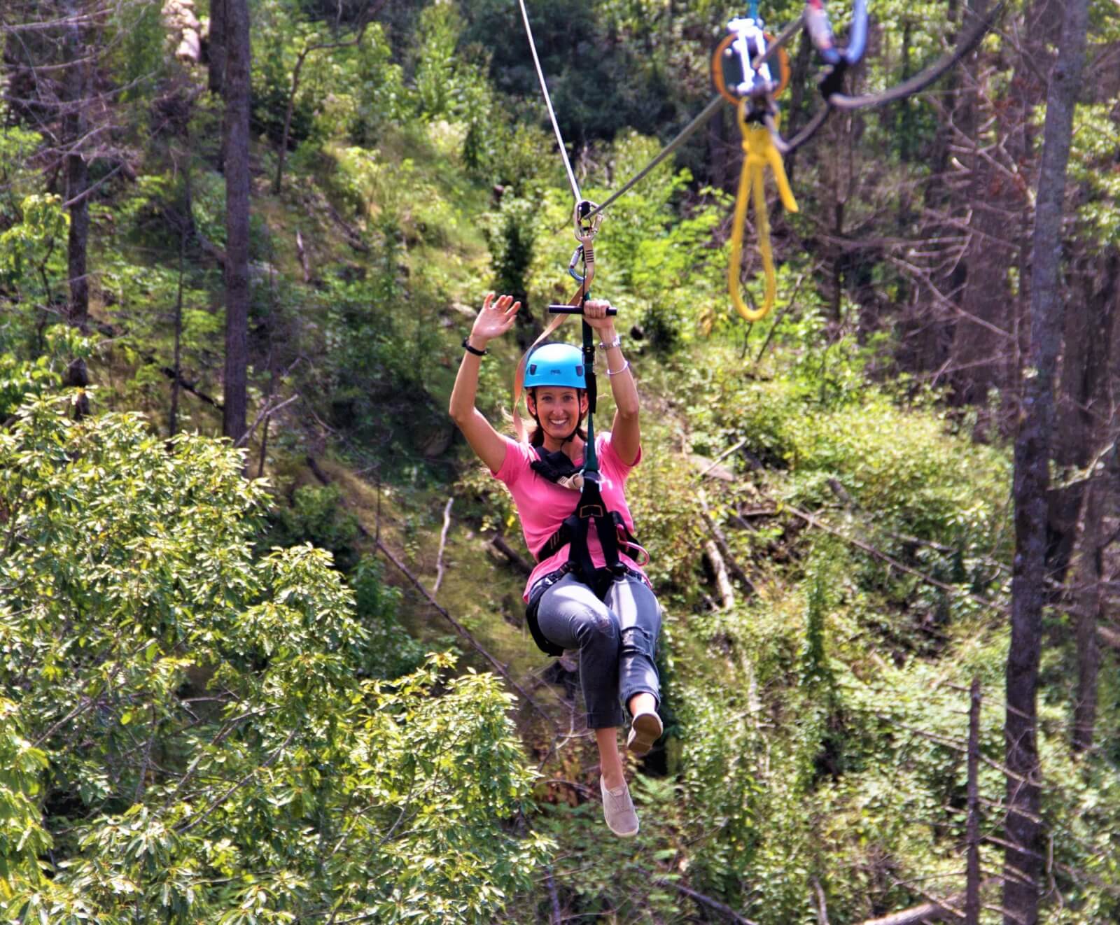 Woman ziplining at Anakeesta