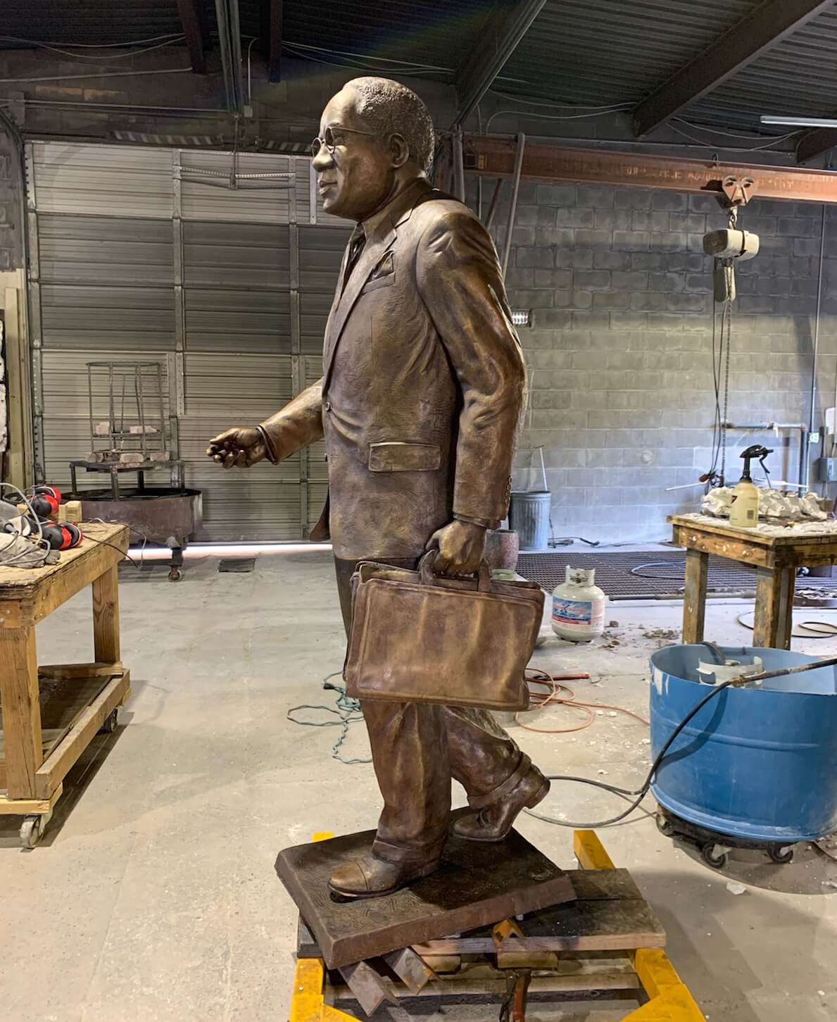 Statue of Julius Chambers carrying a briefcase.