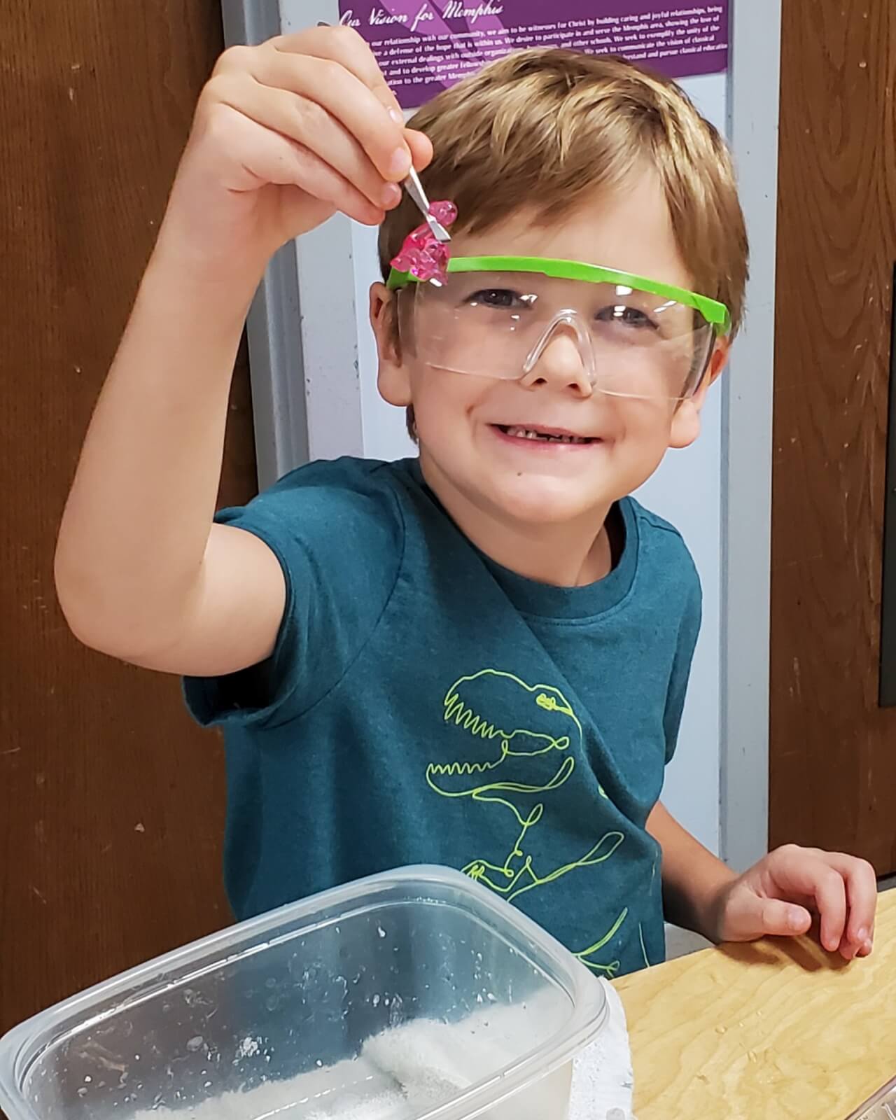 young boy doing science experiment
