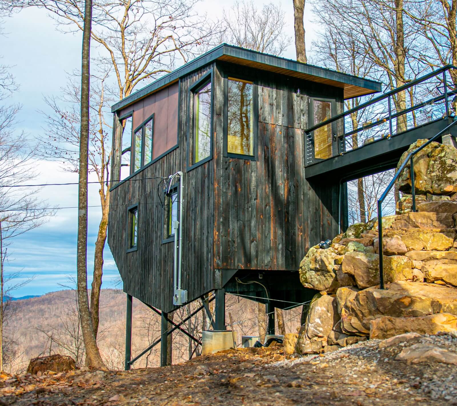 Exterior of treehouse rental on the mountainside. 