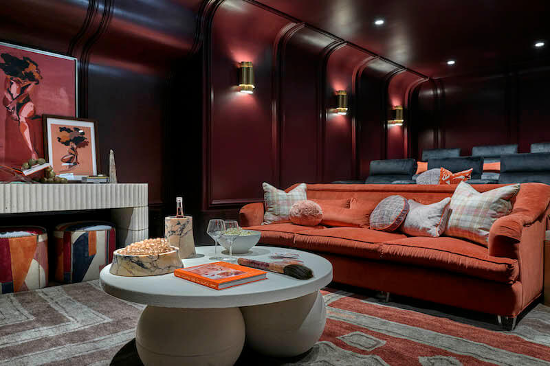 Thatre room with orange velvet sofa