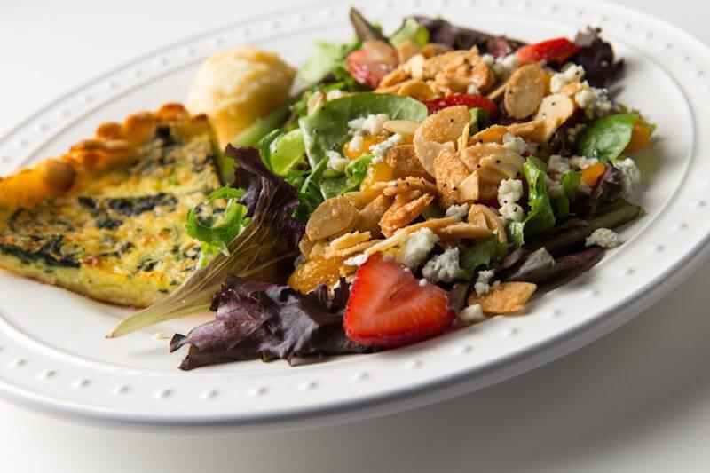 Oval plate with quiche and salad